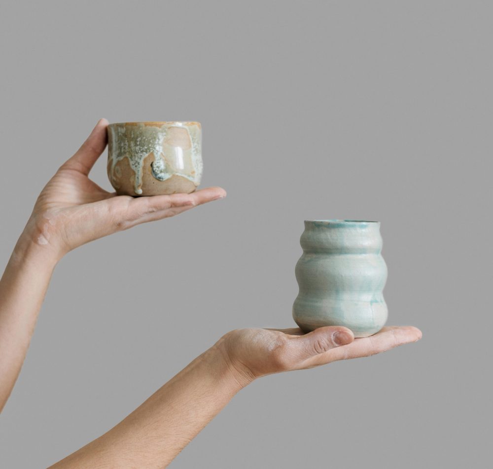 woman-holding-pottery-pieces-made-by-herself